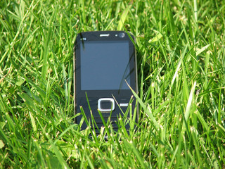 Mobile phone in grass