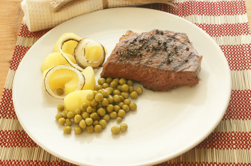 grilled pepper steak with organic potato and pea