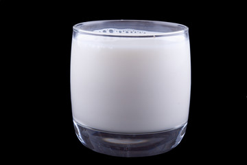 glass of milk isolated  on black