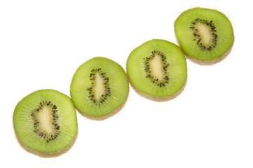Four kiwi fruit slices lit from below