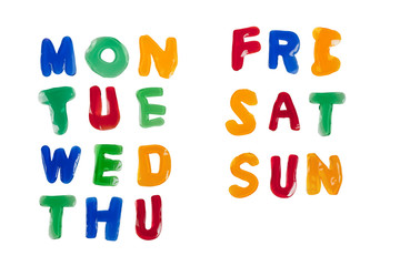 Jelly alphabets forming the days of the week isolated on white