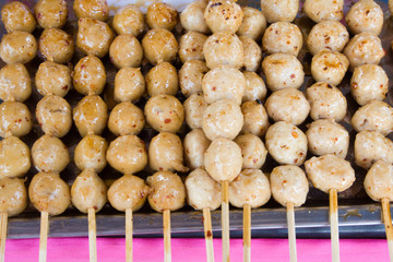 Meatballs on sticks at a market in Thailand