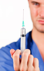 Close-up of a doctor holding an injection