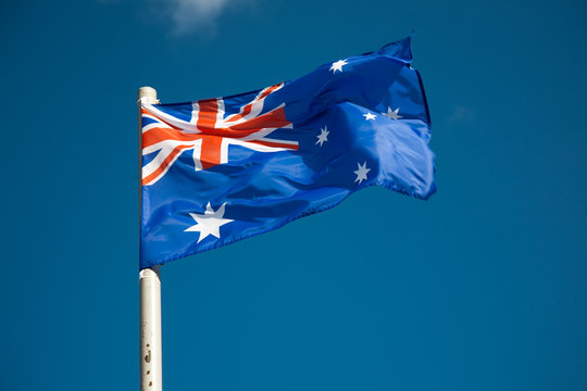 Australian flag against blue sky