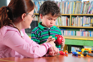 Teacher talking to preschooler