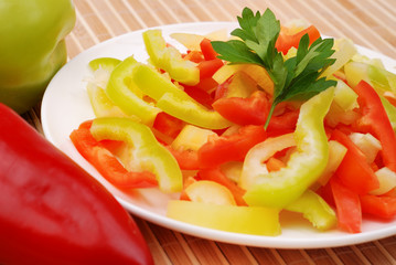 Salad from vegetables on a white plate