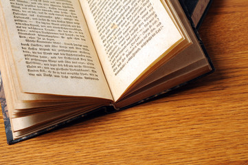 Open old Bible on table