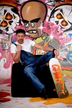 Man skateboard, graffiti wall