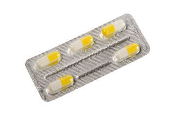 Yellow-white pills in metallic blister.