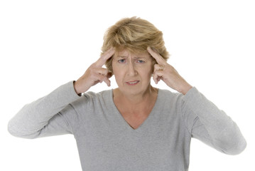 Senior woman pressing her head, with headache or depression.
