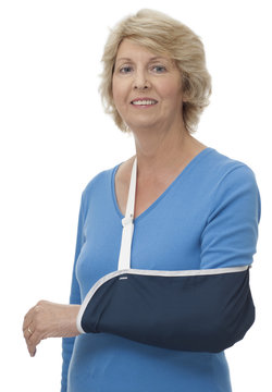 Senior woman with injured arm in sling