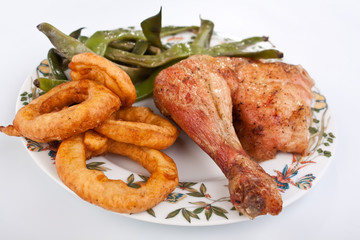 chicken leg with green beans and onion rings