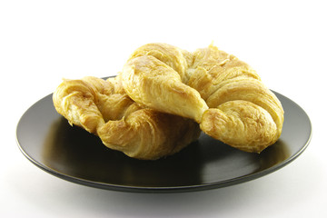 Two Croissants on a Black Plate
