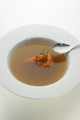 vegetable soup with organic carrot and a spoon