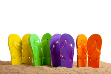 Colorful Flip-Flop Sandles on a Sandy Beach