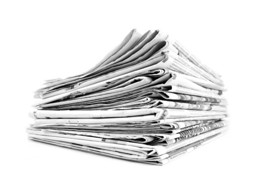Stack of isolated newspapers in black and white