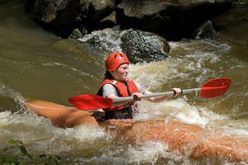 girl white water kayaking