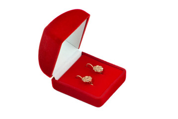 Jewel box with ear-rings inside.