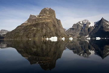 Foto auf Acrylglas Reflection of mountain in the water in Sermilik Fjord © Gentoo Multimedia