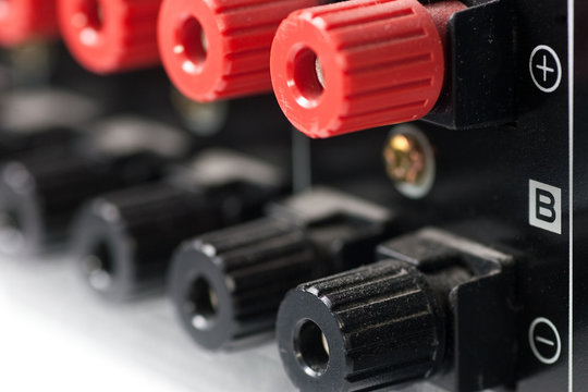 Closeup of red and black speaker terminals from AV Receiver