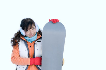 Laughing beautiful girl snowboarder