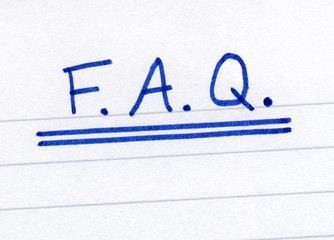 FAQ, frequently asked questions abbreviation, on white paper.