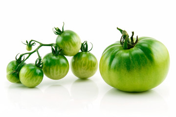 Bunch of Ripe Yellow and Green Tomatoes Isolated on White