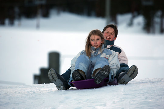 two kids on sled