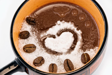 coffee beans, sugar and vanilla in a cup