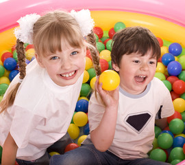 Children and  ball group on playground in park.