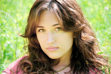 Fototapeta premium portrait of a young beautiful woman outdoors