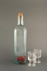 plum brandy with plum inside on the dark background