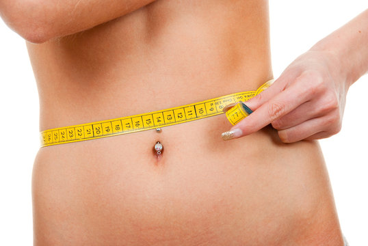 Woman measuring  her waist