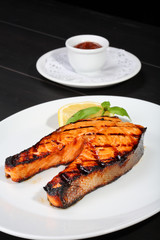 Grilled salmon on the white plate