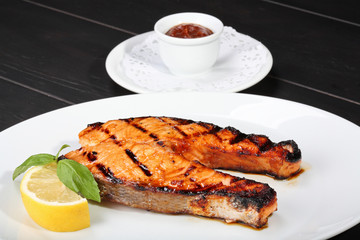 Grilled salmon on the white plate