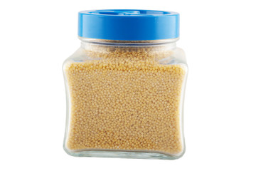 jar with the millet cereals on white