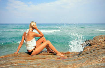 woman relaxing in the afternoon by the sea in Greece