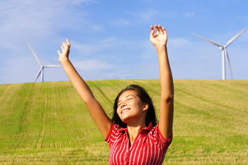 Wind turbines and happy woman