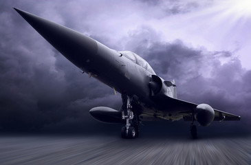 Fototapeta na wymiar Wojskowy samolot na ciemnym niebie