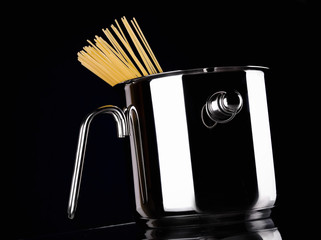 A stainless pot with spaghetti