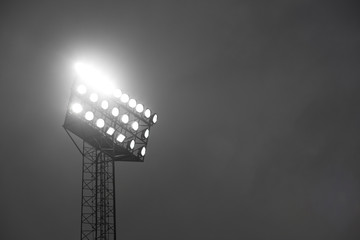 Stadium spotlights lite at night.