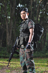 Fototapeta premium Smart Asian Man In Soldier Uniform