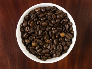 High angle view of coffee beans in a cup.