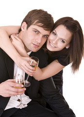 Couple of girl and man kiss and drink wine.