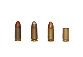 Row of three 9mm Parabellum cartridges and spent case isolated