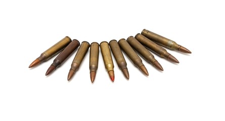 Arch of spread M16 cartridges isolated on white background