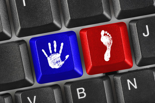 Printout of hand and foot on computer keys
