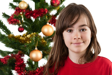 Portrait of girl against Christmas tree