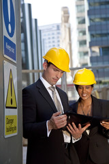 Male and Female Construction Site Managers Having A Meeting