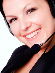 closeup of smiling brunette woman talking by headphone